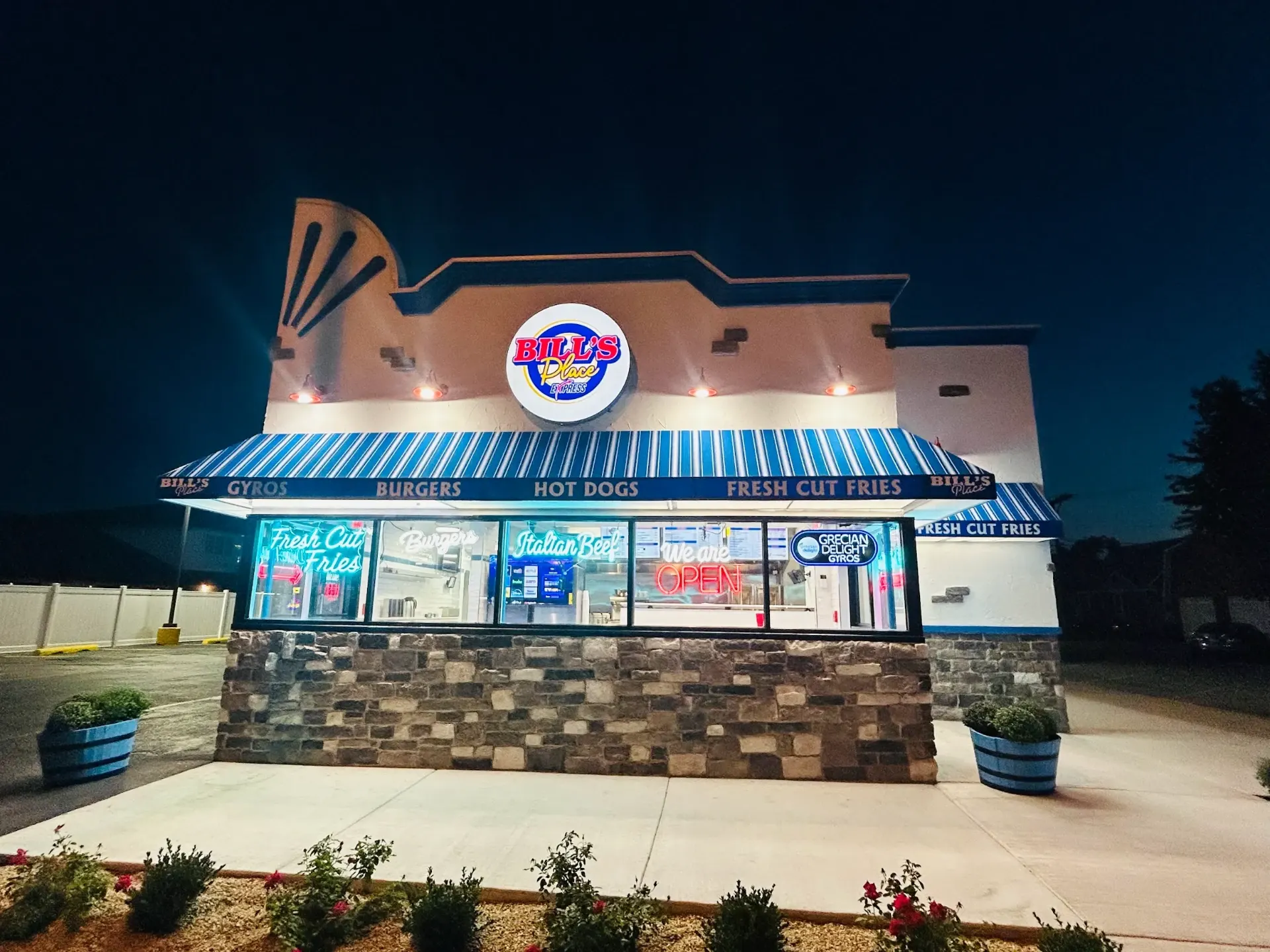 Bill’s Place storefront at night